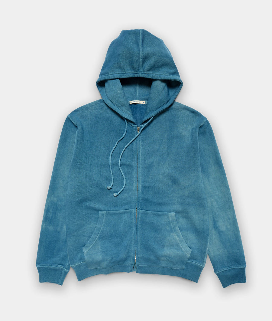 Blue zip-up hoodie displayed flat on a white background - Industry of All Nations