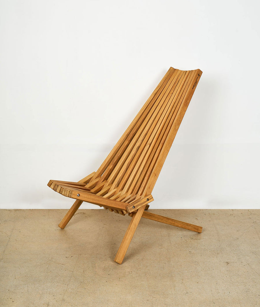 A wooden folding chair with thin, parallel slats - Industry of All Nations